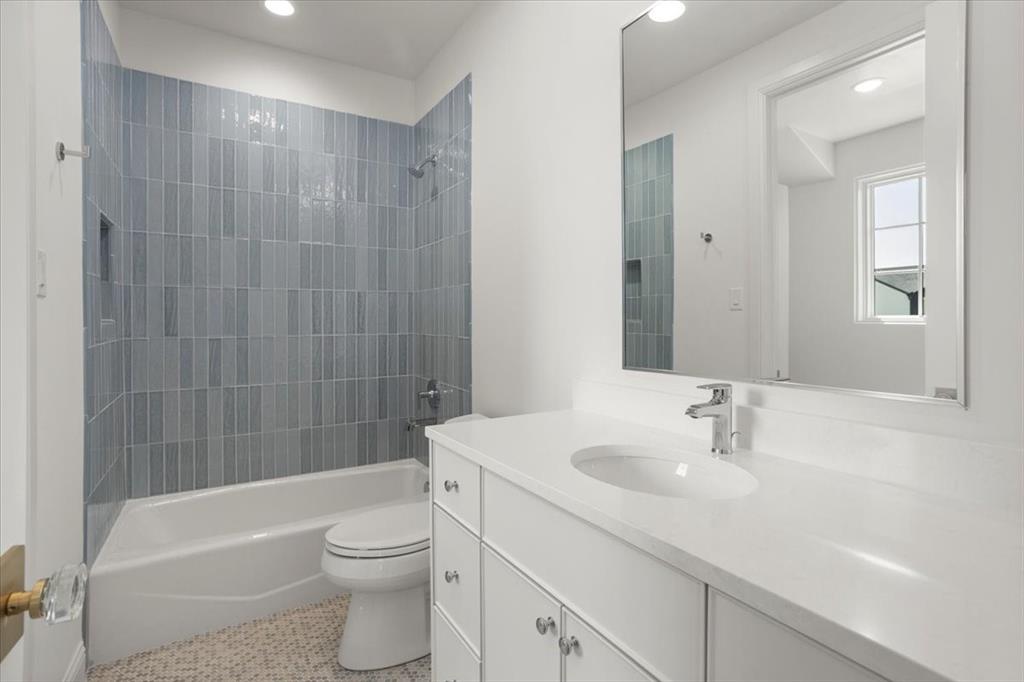3935 Rochelle Drive Dallas, TX 75220 - Photo 23 of 27 a bathroom with a sink a toilet and shower