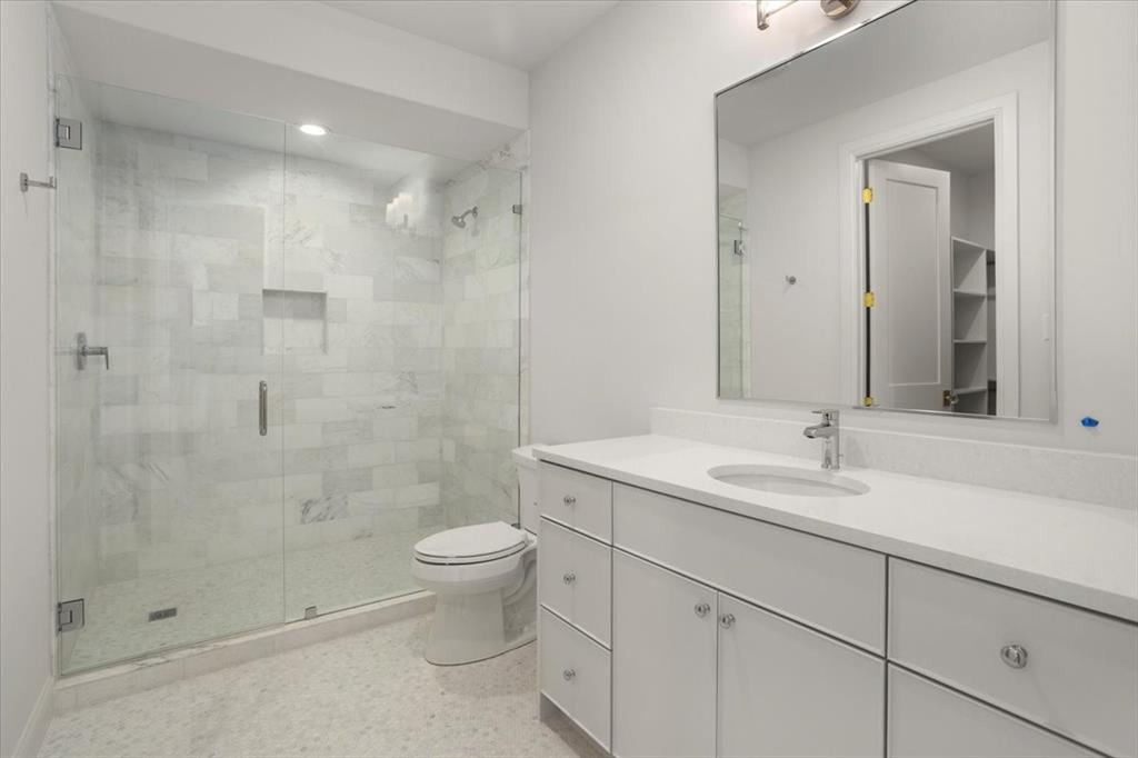 3935 Rochelle Drive Dallas, TX 75220 - Photo 24 of 27 a bathroom with a sink a toilet and shower