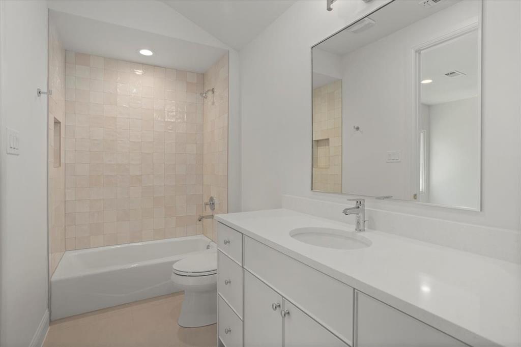 3935 Rochelle Drive Dallas, TX 75220 - Photo 25 of 27 a bathroom with a sink a toilet and shower