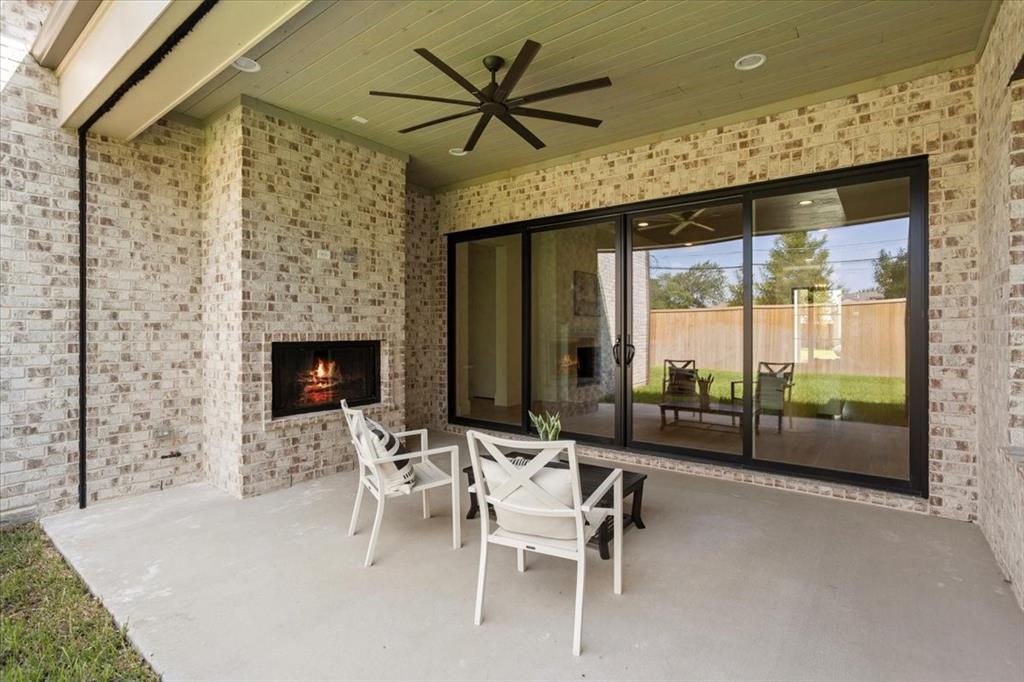 3935 Rochelle Drive Dallas, TX 75220 - Photo 26 of 27 a dining room with furniture and a floor to ceiling window