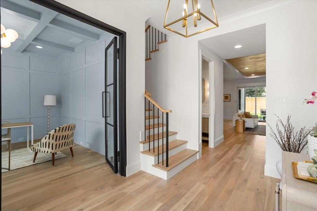 3935 Rochelle Drive Dallas, TX 75220 - Photo 6 of 27 a view of a hallway with wooden floor and a livingroom