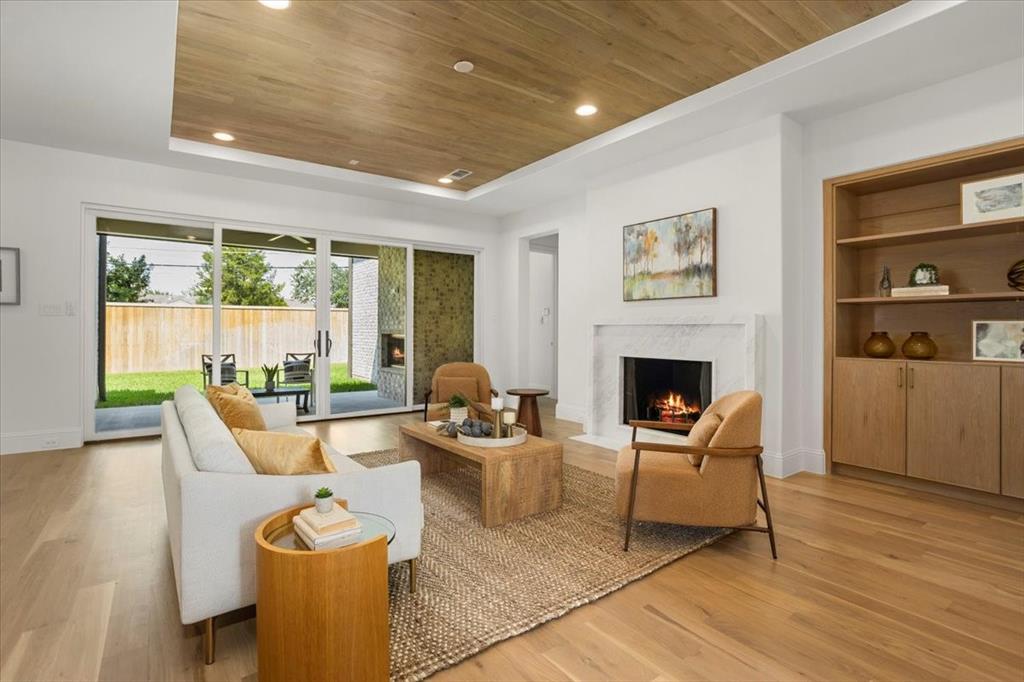 3935 Rochelle Drive Dallas, TX 75220 - Photo 8 of 27 a living room with furniture and a fireplace