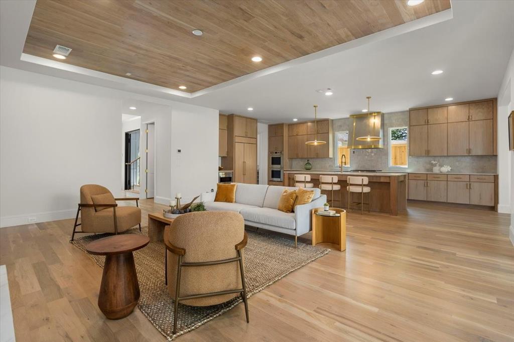 3935 Rochelle Drive Dallas, TX 75220 - Photo 10 of 27 a living room with furniture and kitchen view