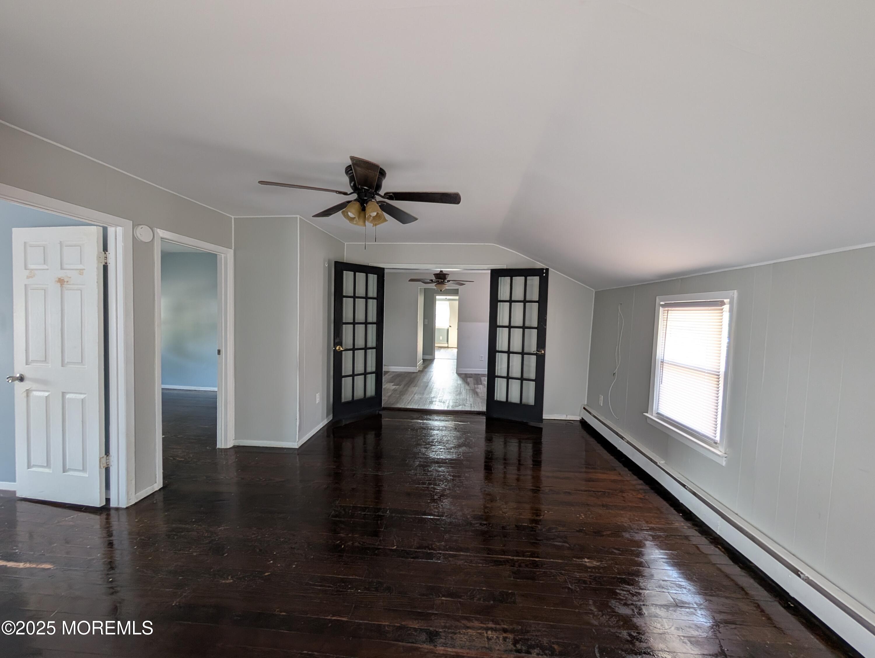 164 Port Monmouth Road, Unit B Keansburg, NJ 07734 - Photo 11 of 17 a view of empty room with wooden floor and fan