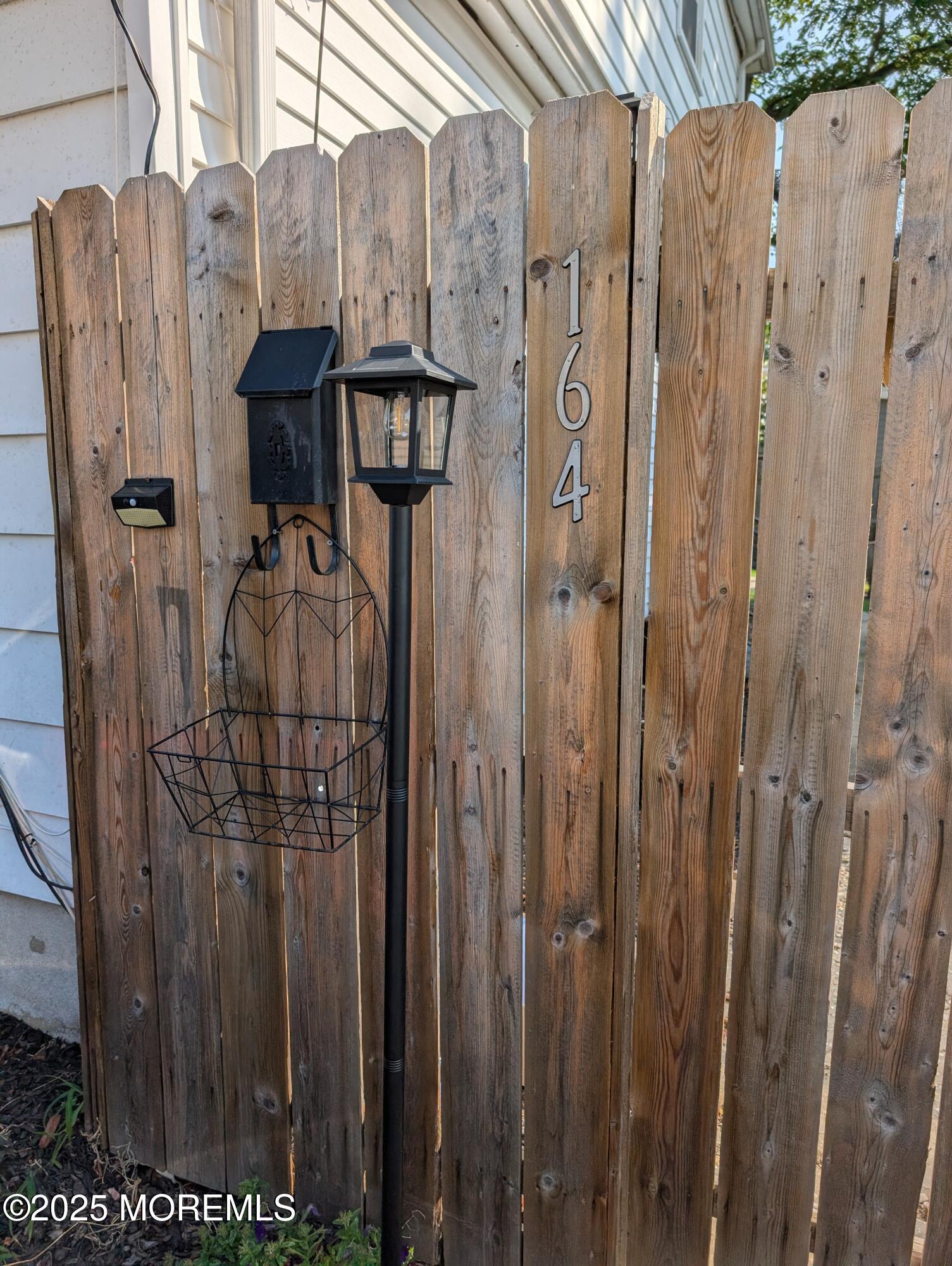 164 Port Monmouth Road, Unit B Keansburg, NJ 07734 - Photo 15 of 17 a view of a wooden door with a wooden fence