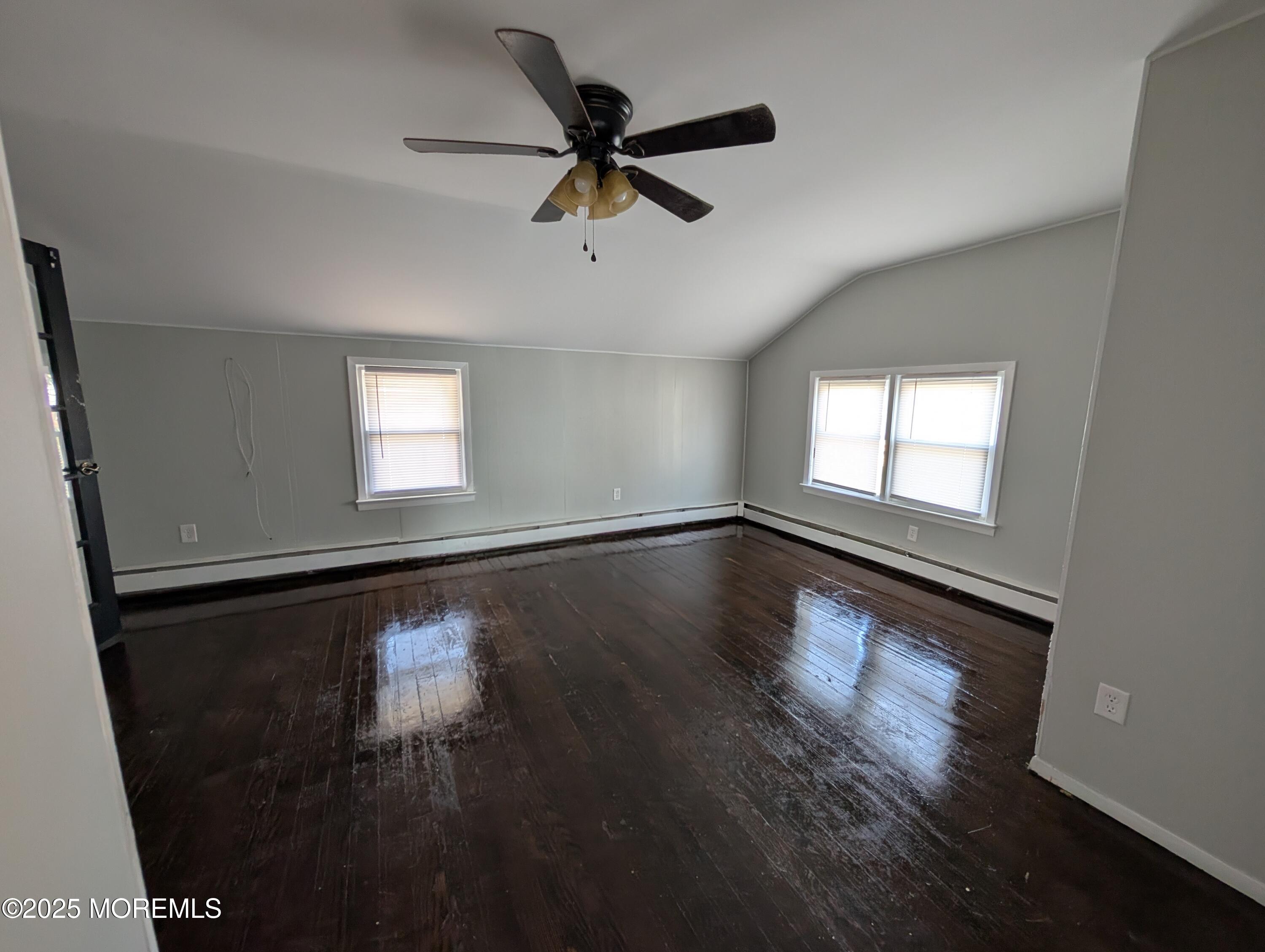 164 Port Monmouth Road, Unit B Keansburg, NJ 07734 - Photo 10 of 17 a view of empty room with wooden floor and fan