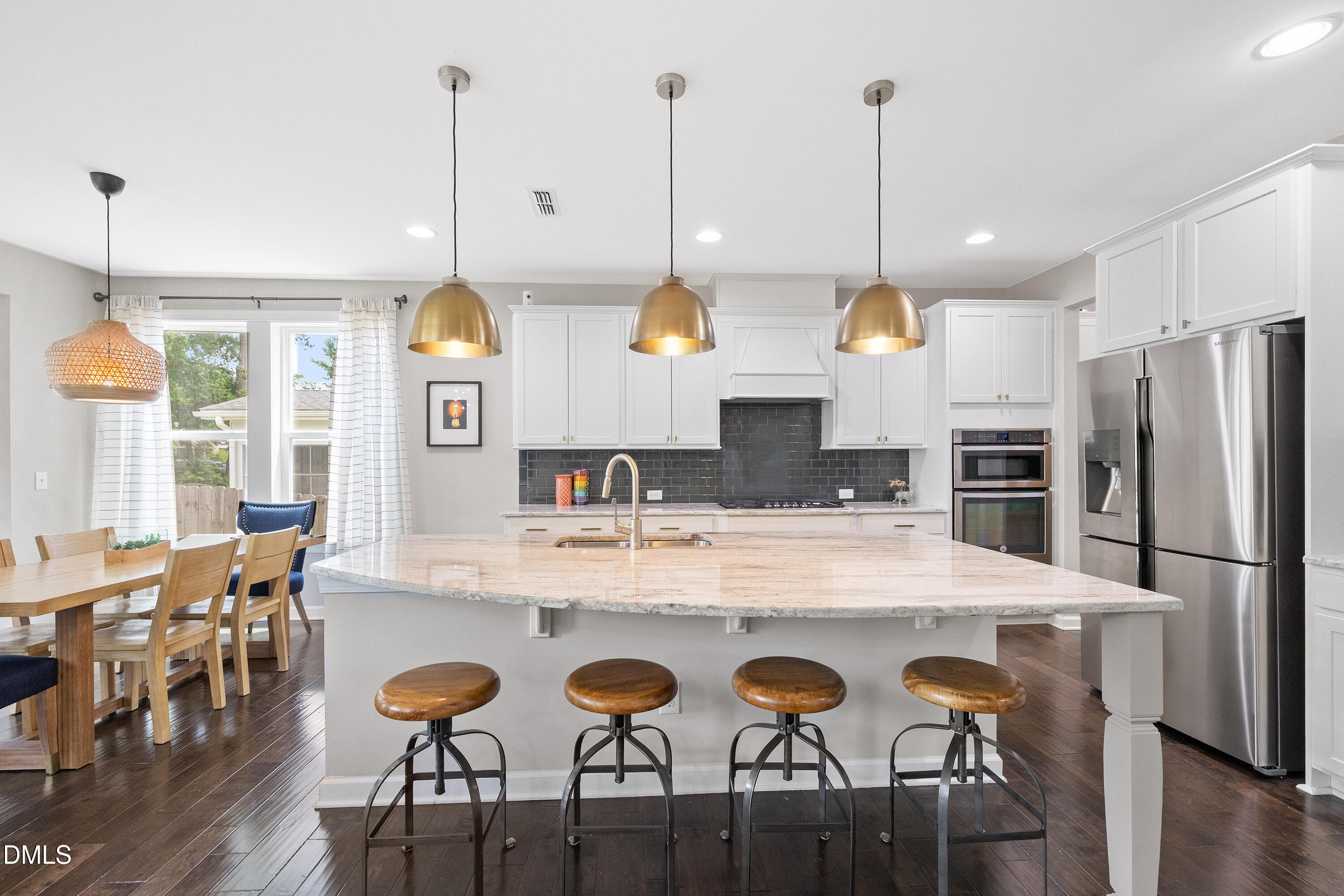 8059 Gilano Drive Raleigh, NC 27603 - Photo 3 of 43 a large kitchen with a table and chairs