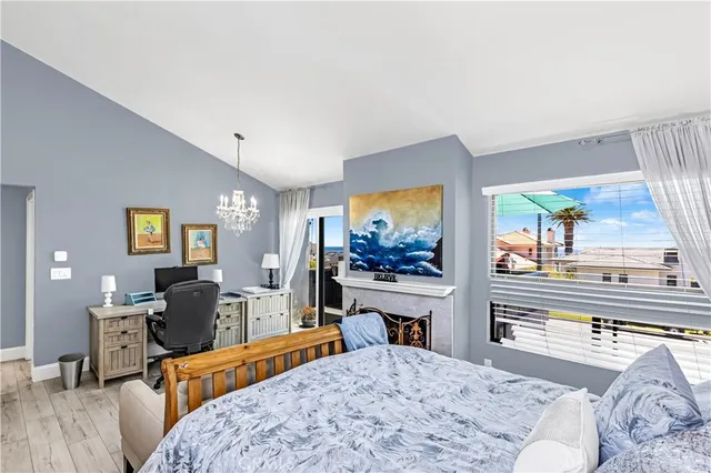 a bedroom with furniture and a flat screen tv