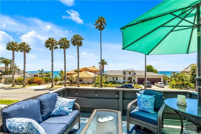 a view of a chairs and table in the patio