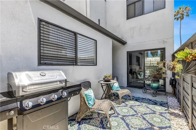 a view of a chairs and table in a patio