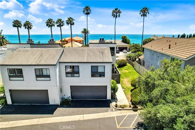 a view of a house with swimming pool and a tree