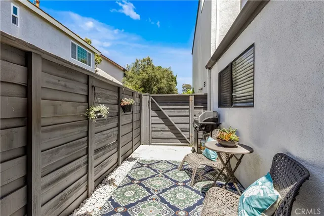 a view of outdoor seating space with wooden floor