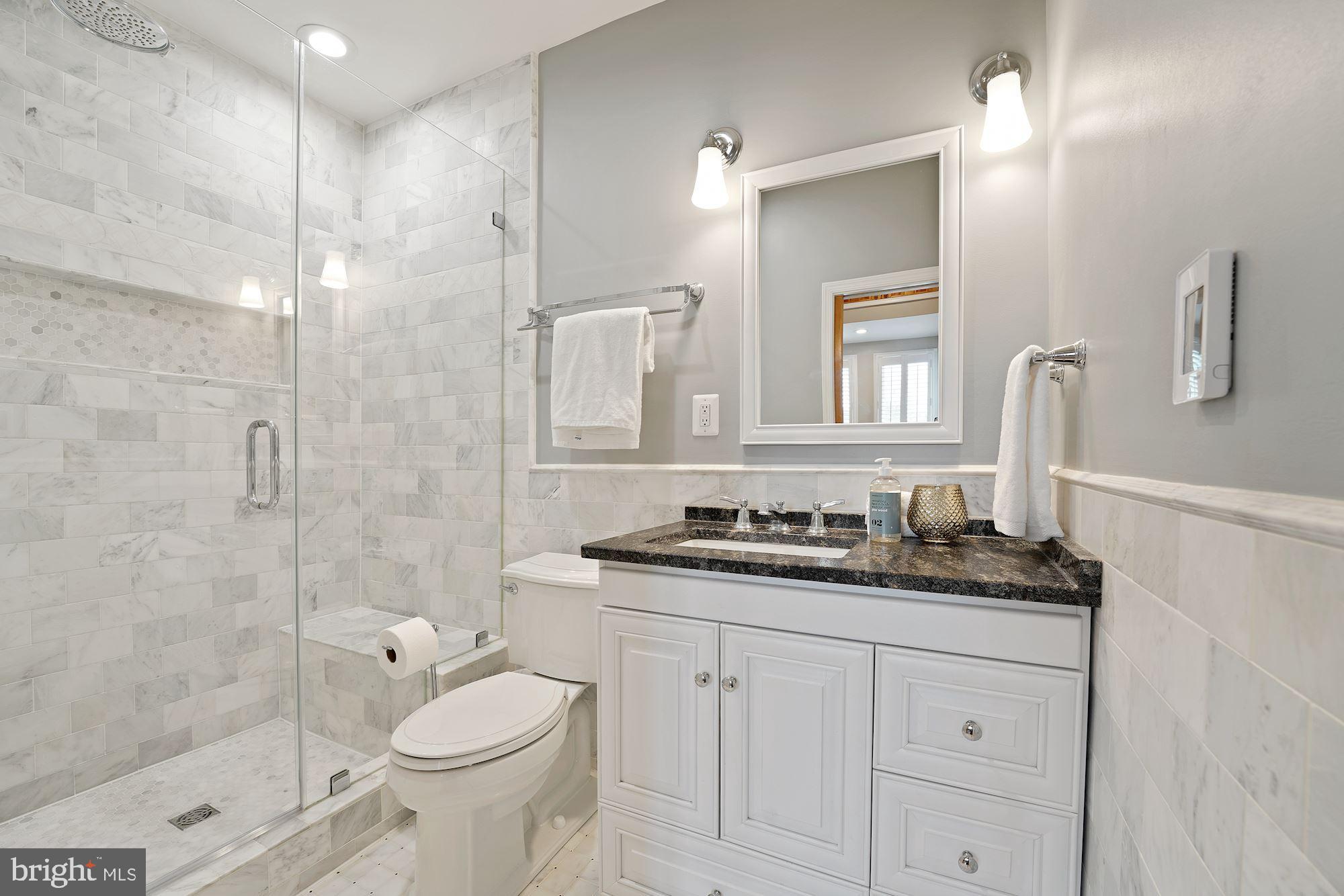 1106 K Street Northeast Washington, DC 20002 - Photo 14 of 26 Marble tiles, heated floor & multi-head shower