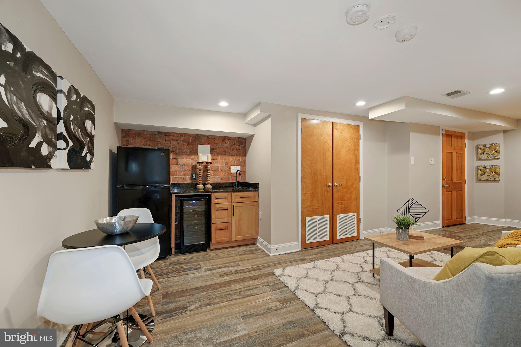1106 K Street Northeast Washington, DC 20002 - Photo 19 of 26 Ground level living area with wet bar and fridge