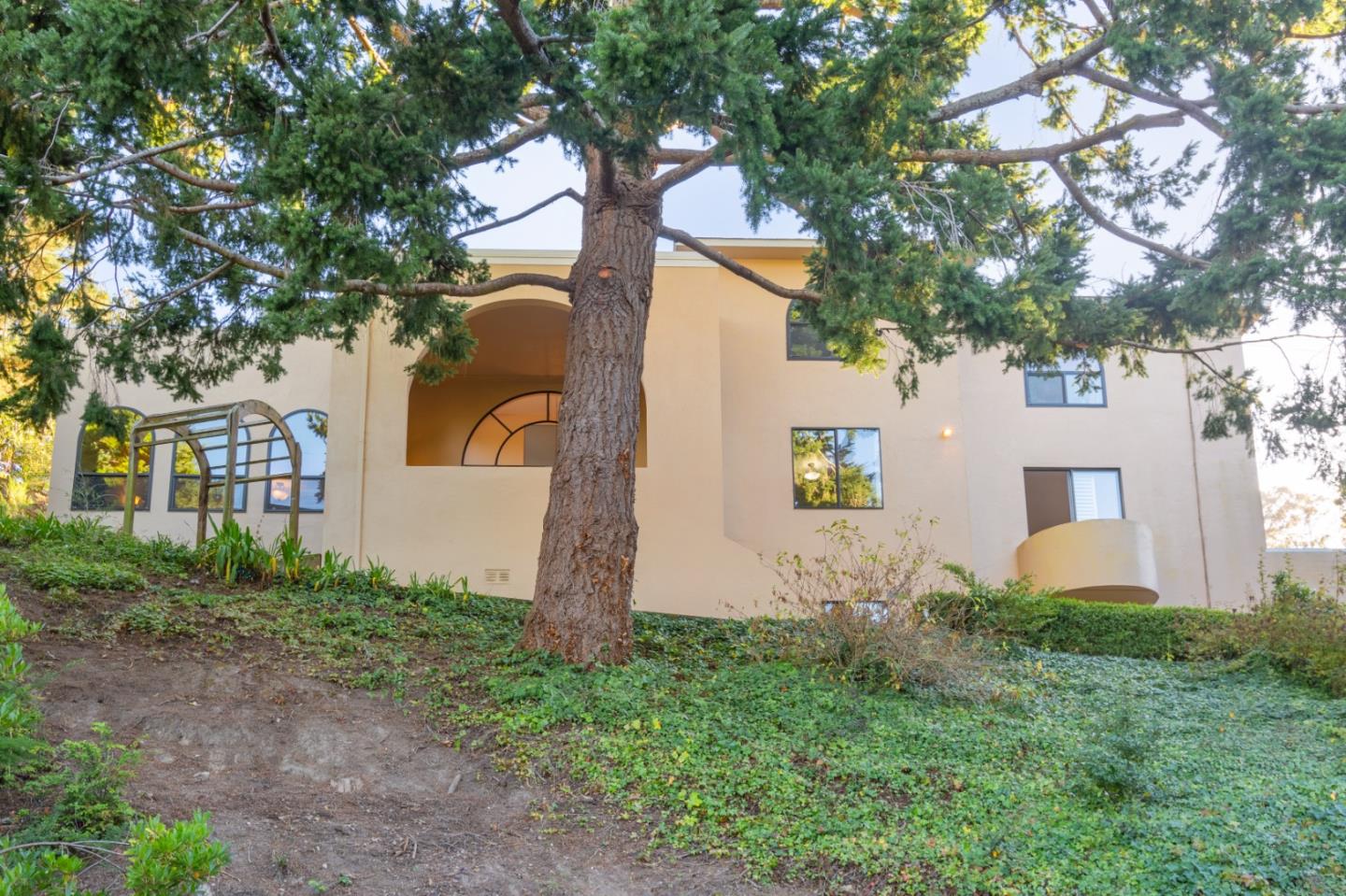 a front view of a house with garden