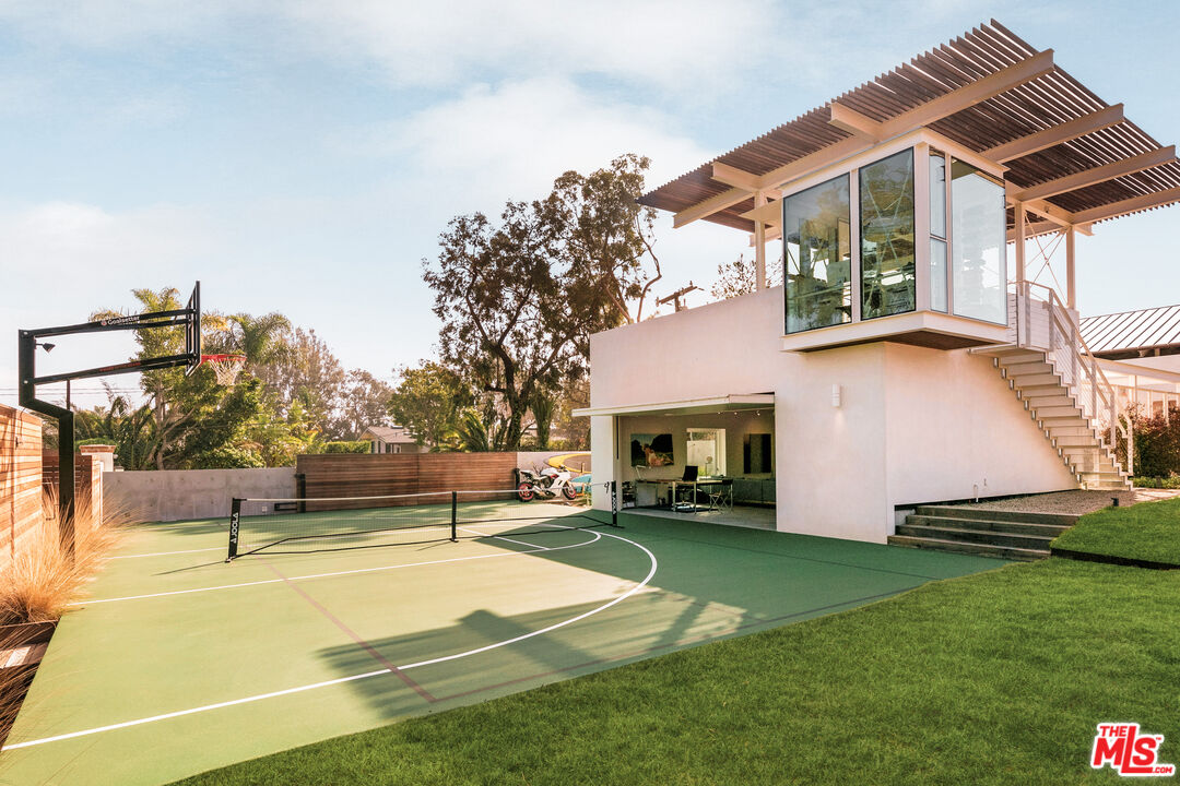 6728 Wildlife Road Malibu, CA 90265 - Photo 31 of 57 a view of a house with a backyard and a patio