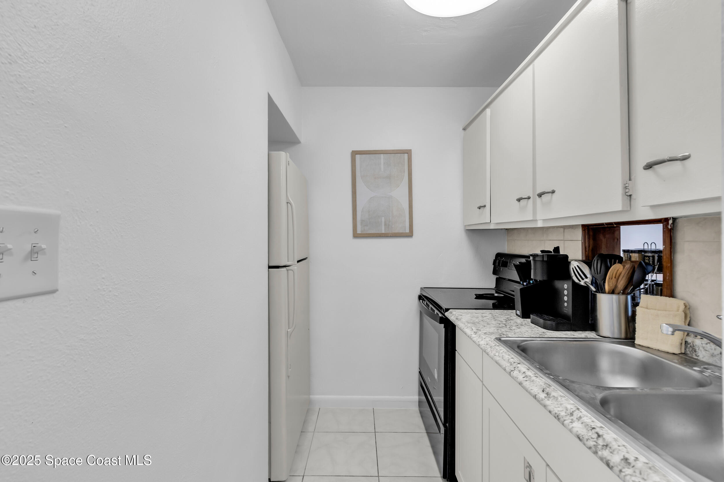 202 Caroline Street, Unit 105 Cape Canaveral, FL 32920 - Photo 8 of 14 8_202 caroline st #105 - 08