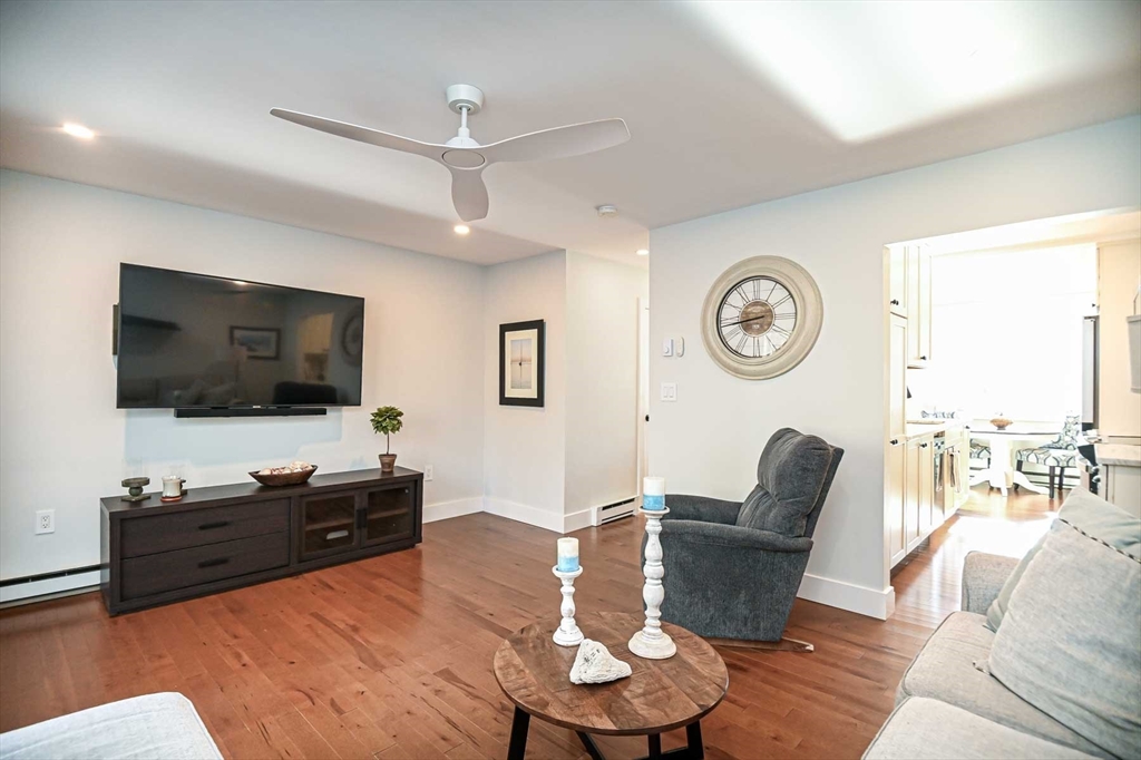 1 Acadia Kimball Road, Unit 1 Amesbury, MA 01913 - Photo 12 of 21 a living room with furniture and a flat screen tv