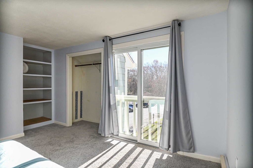 1 Acadia Kimball Road, Unit 1 Amesbury, MA 01913 - Photo 17 of 21 a view of a room with a large window