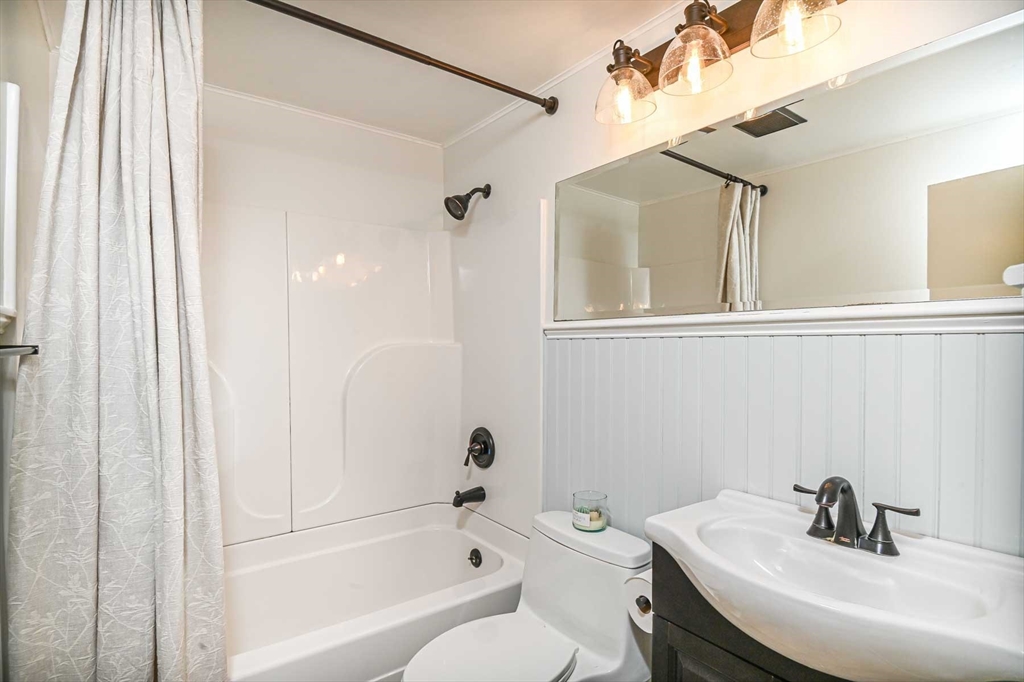 1 Acadia Kimball Road, Unit 1 Amesbury, MA 01913 - Photo 18 of 21 a bathroom with a sink a toilet and shower