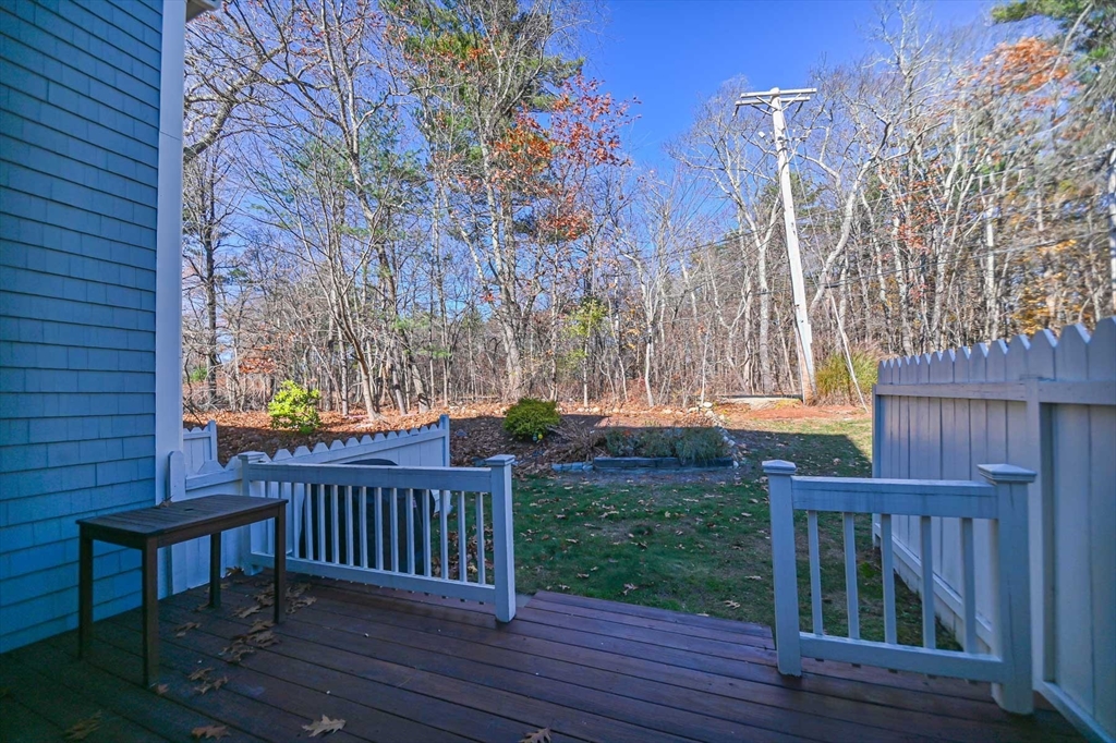 1 Acadia Kimball Road, Unit 1 Amesbury, MA 01913 - Photo 20 of 21 a view of a wooden deck and a backyard