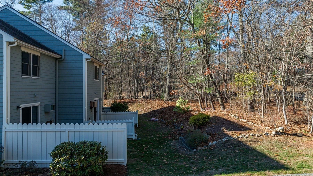 1 Acadia Kimball Road, Unit 1 Amesbury, MA 01913 - Photo 21 of 21 a view of a house with a yard and plants