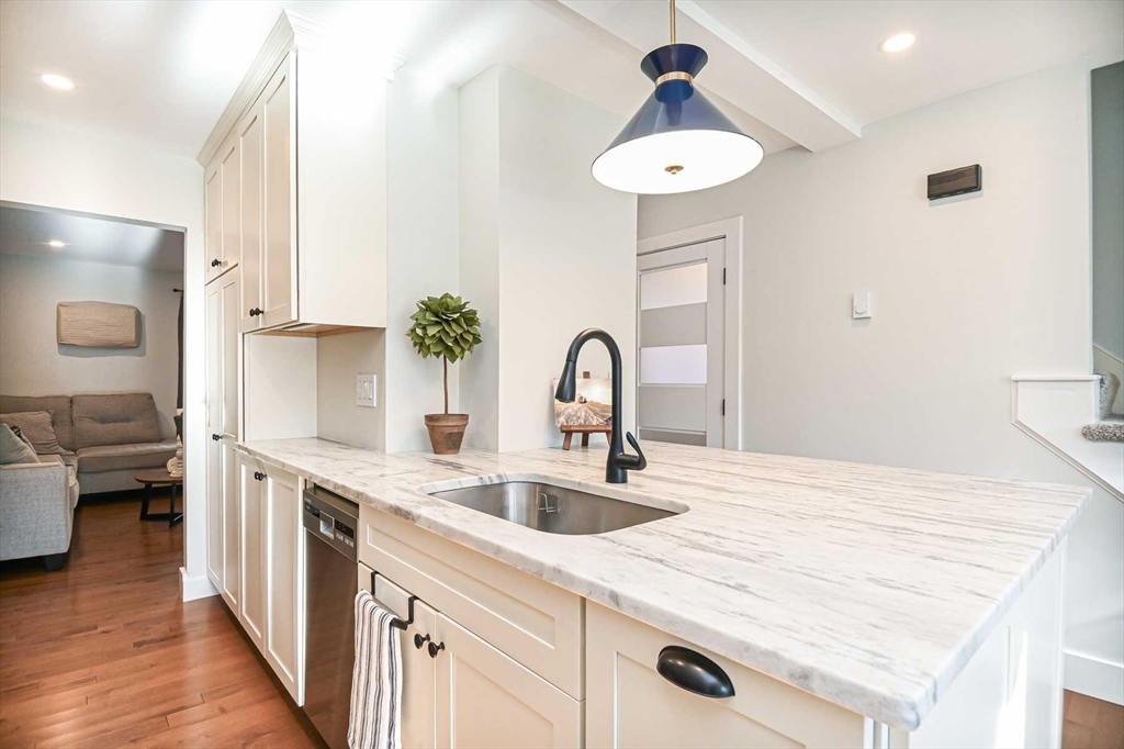 1 Acadia Kimball Road, Unit 1 Amesbury, MA 01913 - Photo 6 of 21 a kitchen with a sink a stove and cabinets