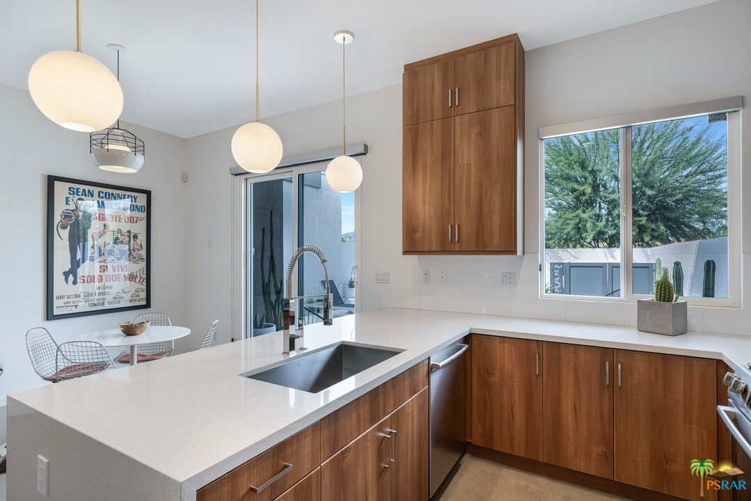 504 Paragon Loop Palm Springs, CA 92262 - Photo 11 of 45 a kitchen with a sink cabinets and window