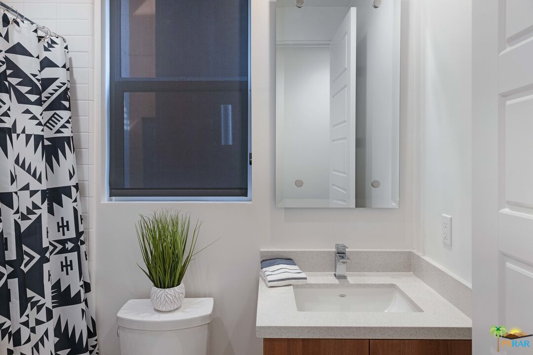 504 Paragon Loop Palm Springs, CA 92262 - Photo 18 of 45 a bathroom with a sink and a toilet
