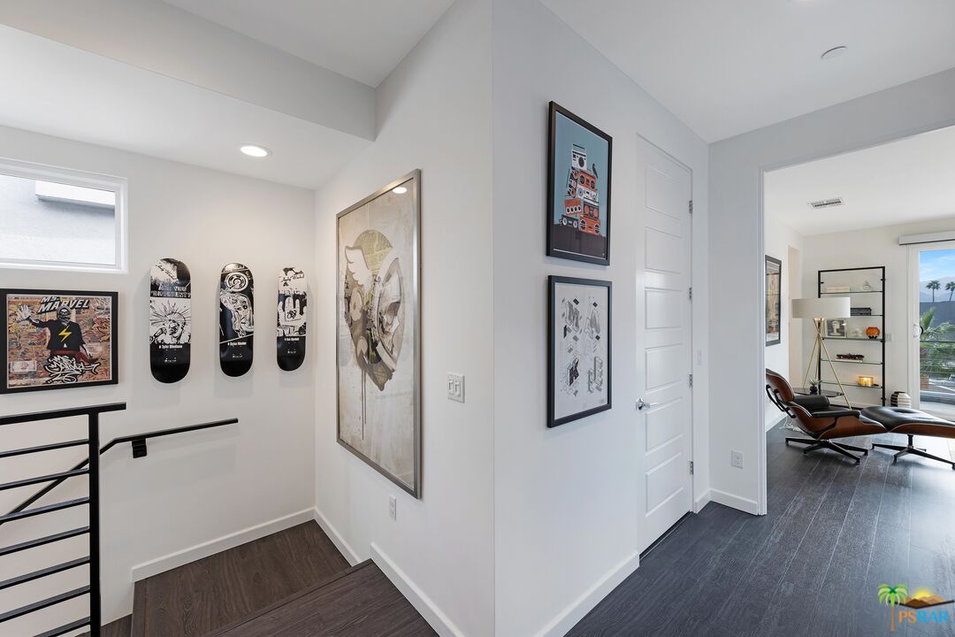 504 Paragon Loop Palm Springs, CA 92262 - Photo 22 of 45 a view of a hallway with wooden floor and windows