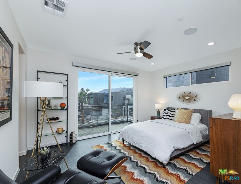 504 Paragon Loop Palm Springs, CA 92262 - Photo 23 of 45 a bedroom with a bed and a large window