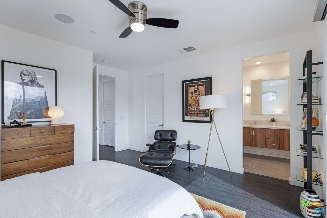 504 Paragon Loop Palm Springs, CA 92262 - Photo 26 of 45 a bedroom with a bed and wooden floor