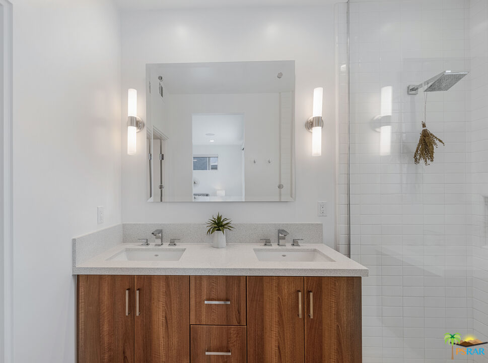 504 Paragon Loop Palm Springs, CA 92262 - Photo 27 of 45 a bathroom with a sink and a mirror