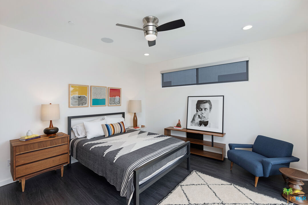 504 Paragon Loop Palm Springs, CA 92262 - Photo 29 of 45 a bedroom with a bed and a couch