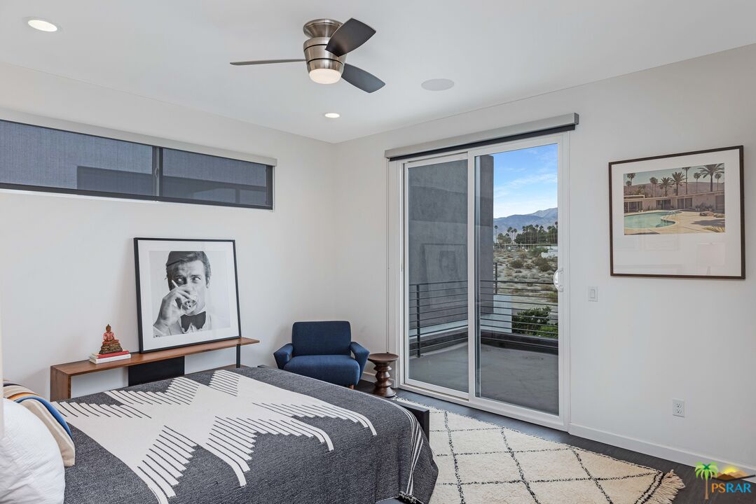 504 Paragon Loop Palm Springs, CA 92262 - Photo 30 of 45 a bedroom with a bed and a painting on the wall