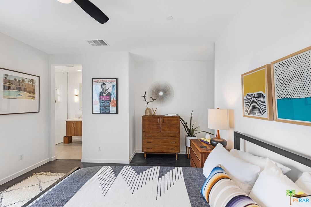 504 Paragon Loop Palm Springs, CA 92262 - Photo 33 of 45 a bedroom with a bed and wooden floor