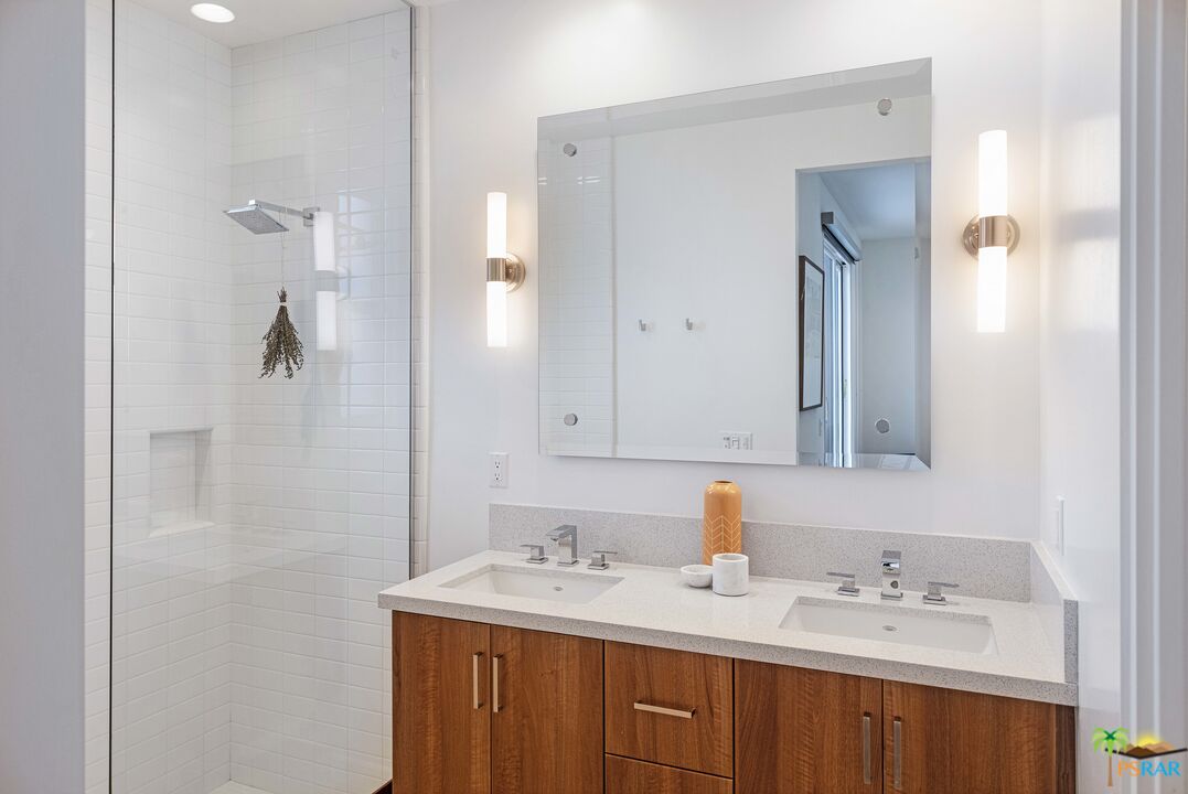 504 Paragon Loop Palm Springs, CA 92262 - Photo 34 of 45 a bathroom with a sink and a mirror