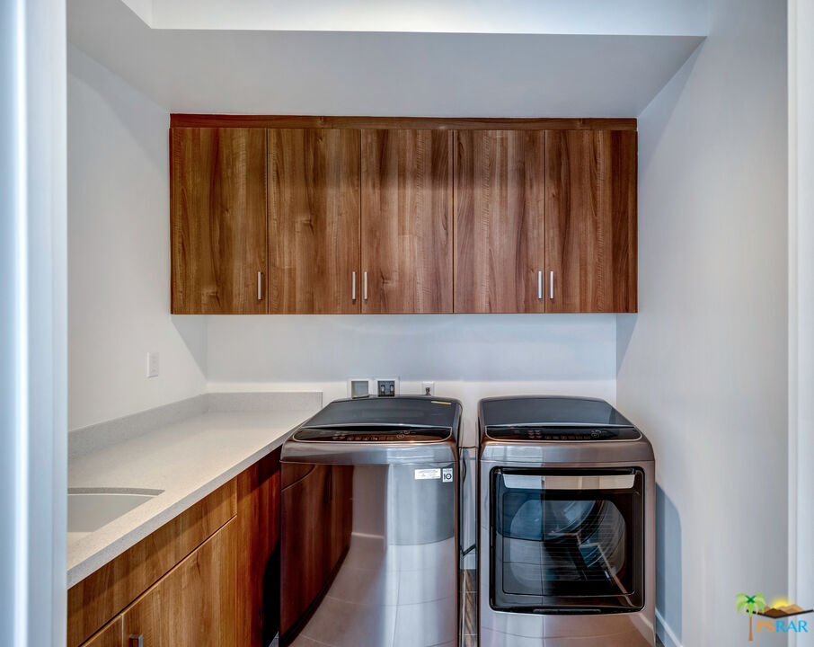 504 Paragon Loop Palm Springs, CA 92262 - Photo 36 of 45 a utility room with dryer and washer