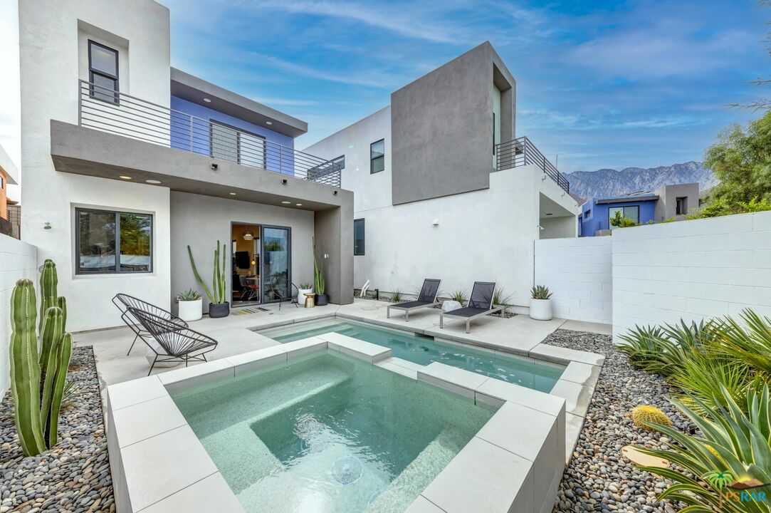 504 Paragon Loop Palm Springs, CA 92262 - Photo 37 of 45 a view of a house with swimming pool and sitting area