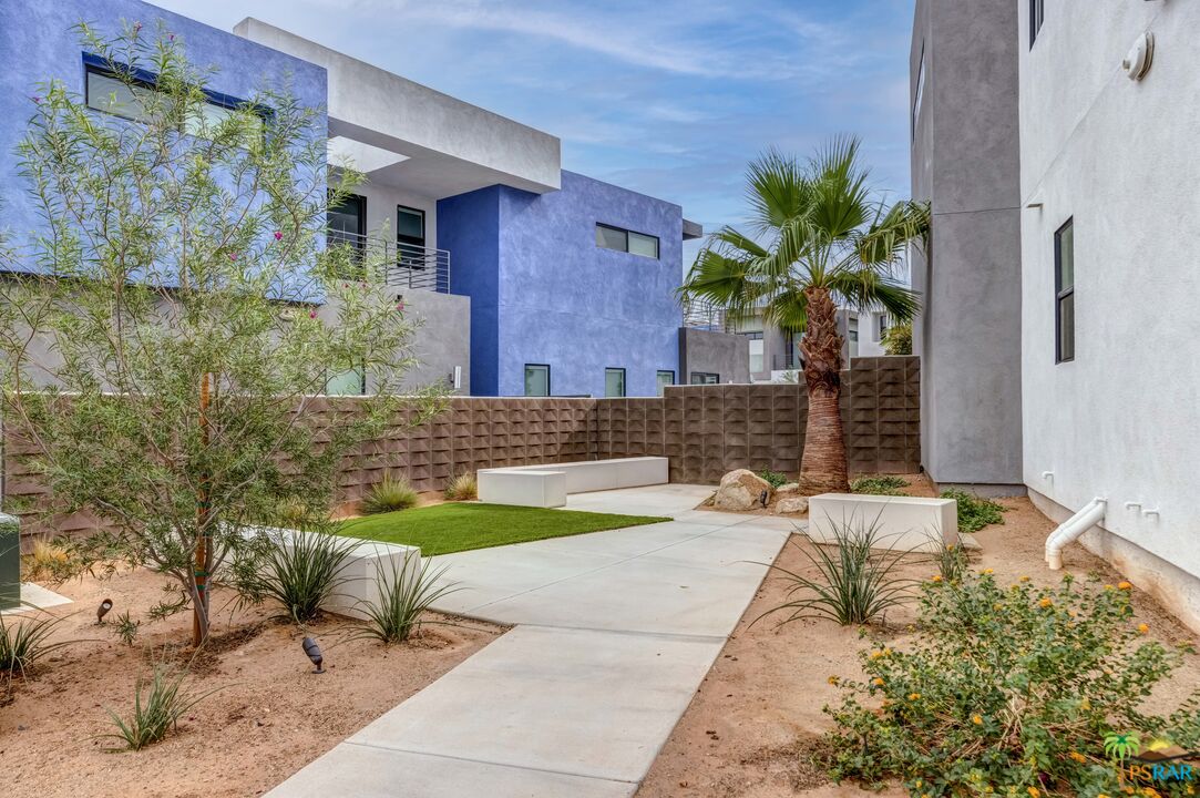 504 Paragon Loop Palm Springs, CA 92262 - Photo 41 of 45 a front view of a house with garden