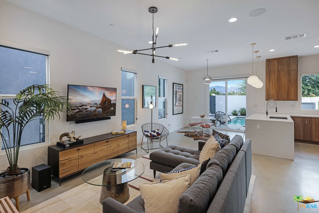 504 Paragon Loop Palm Springs, CA 92262 - Photo 5 of 45 a living room with furniture and a flat screen tv