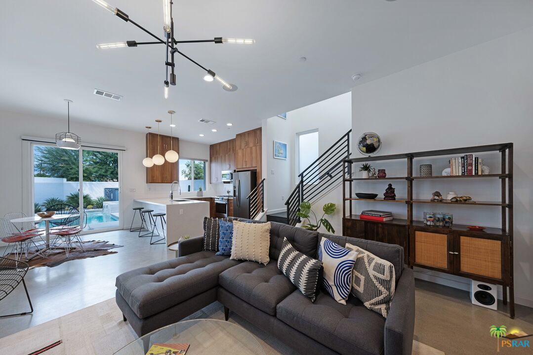 504 Paragon Loop Palm Springs, CA 92262 - Photo 6 of 45 a living room with furniture ceiling fan and a window