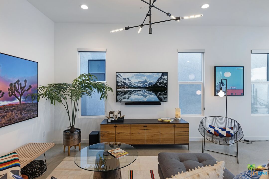 504 Paragon Loop Palm Springs, CA 92262 - Photo 7 of 45 a living room with furniture and a potted plant