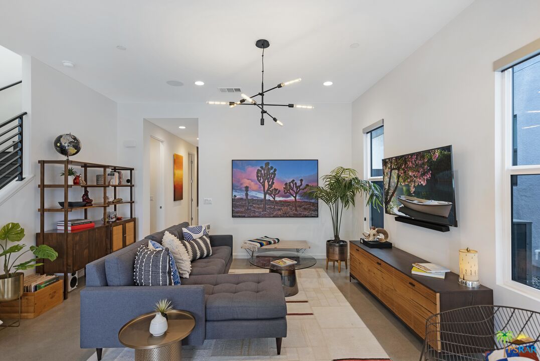 504 Paragon Loop Palm Springs, CA 92262 - Photo 8 of 45 a living room with furniture and a flat screen tv