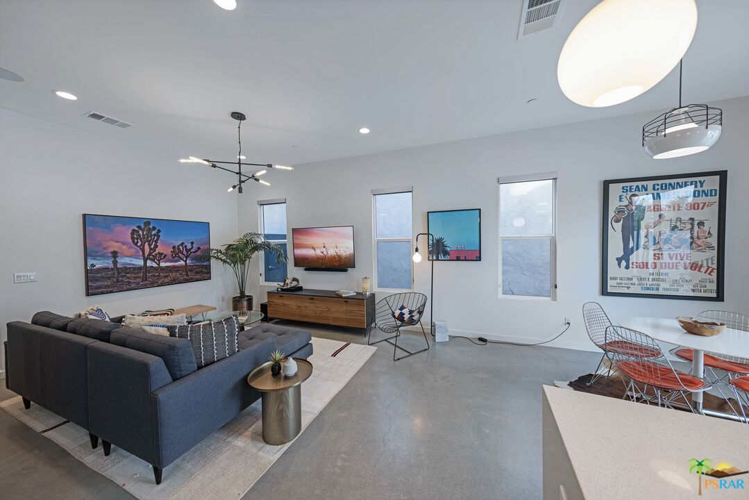 504 Paragon Loop Palm Springs, CA 92262 - Photo 9 of 45 a living room with furniture and a flat screen tv