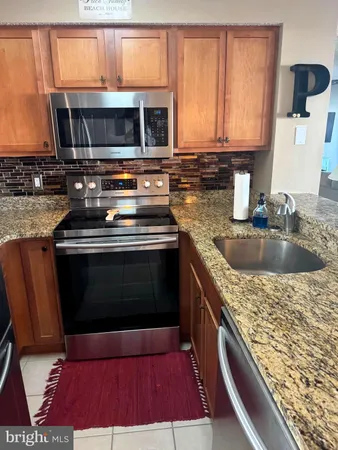 a kitchen with a stove and a sink