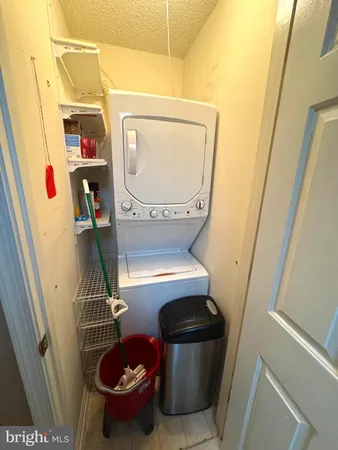 a room with water heater and wooden racks