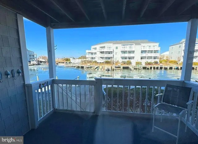 a view of a balcony with wooden floor