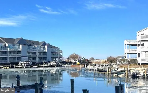 a large body of water next to a building with water view