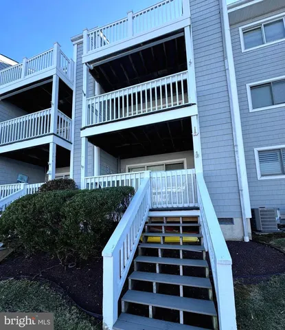 a view of a balcony with car parked